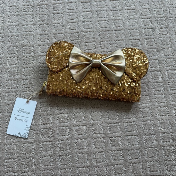 Loungefly Accessories - ( SOLD )NWT Minnie lounge fly gold sequin wallet